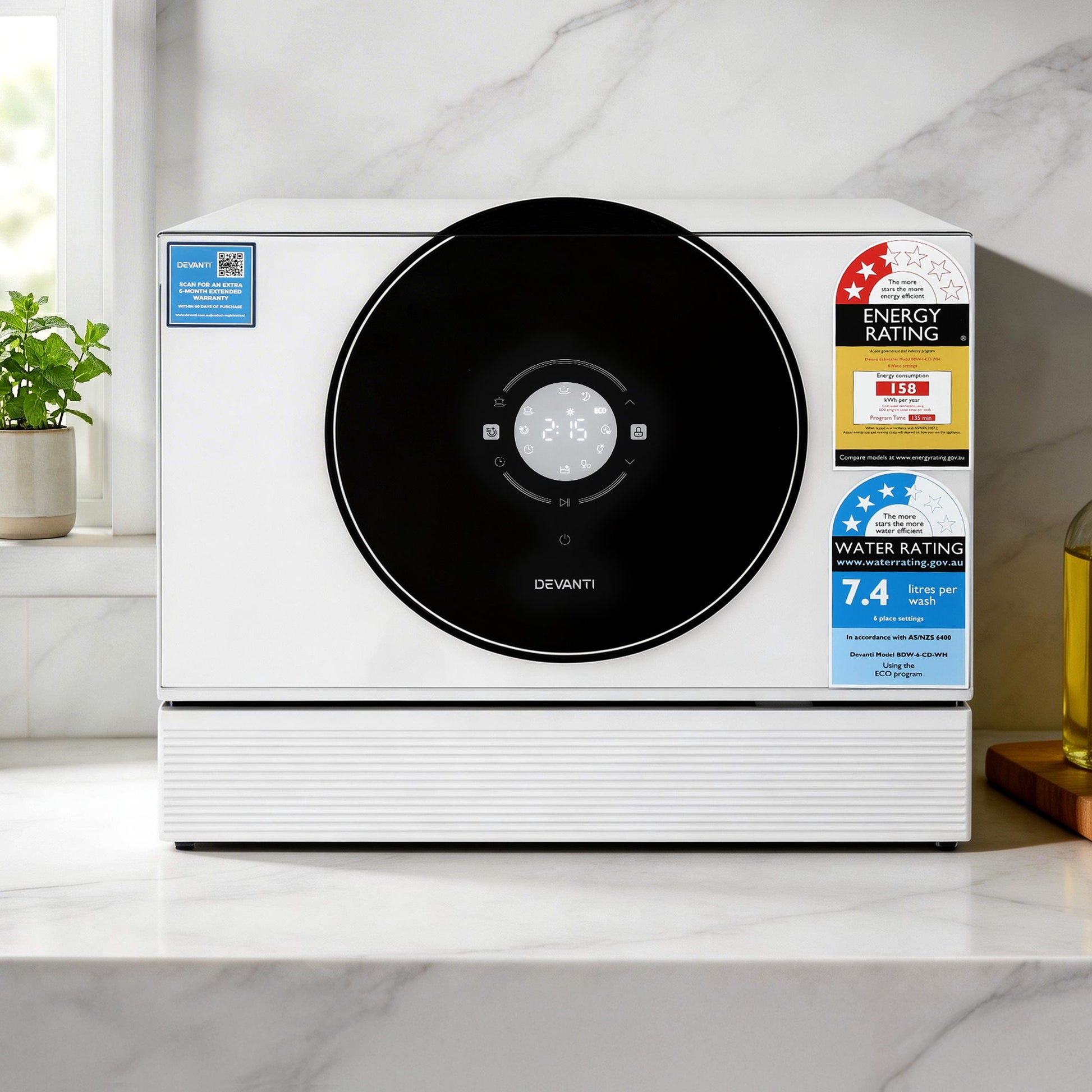 Devanti countertop dishwasher with energy and water rating labels on marble kitchen counter