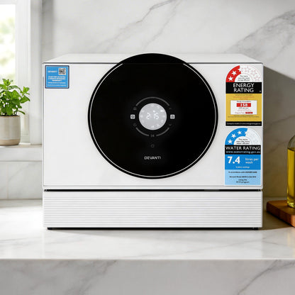 Devanti countertop dishwasher with energy and water rating labels on marble kitchen counter