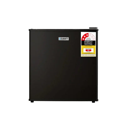 Black mini bar fridge with energy rating sticker on front door, compact refrigerator design.