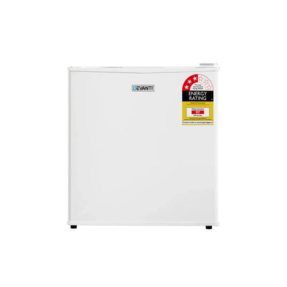 Compact white bar fridge with energy rating label on door, single door mini refrigerator