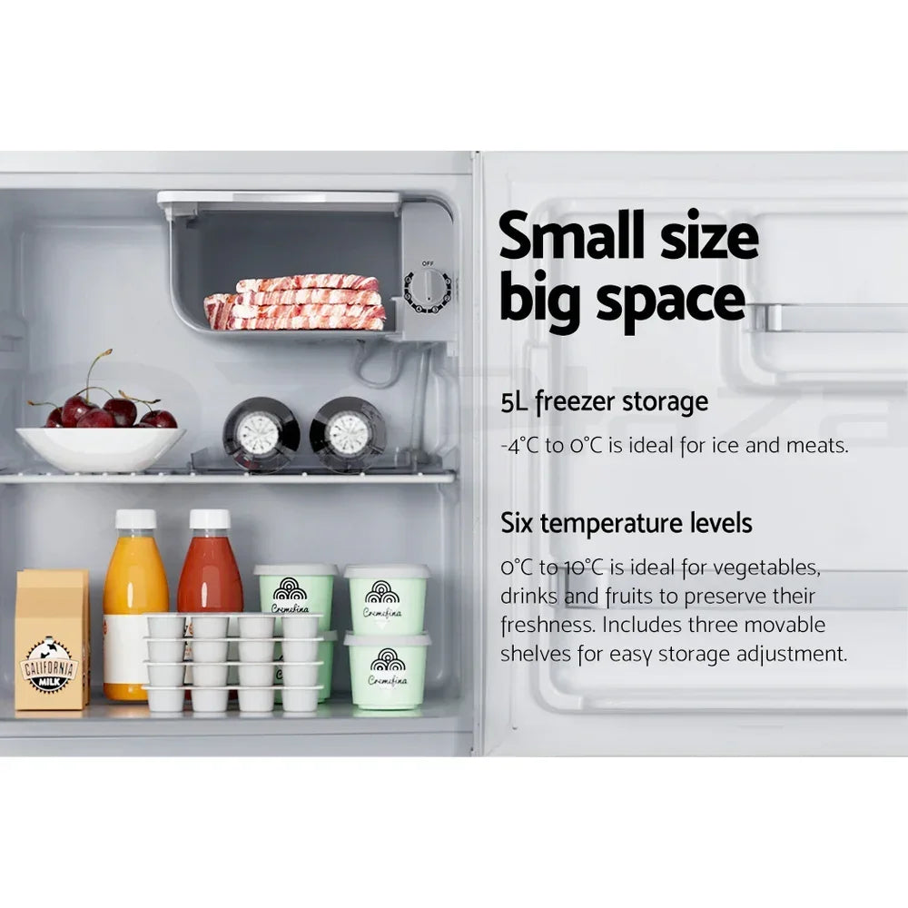 Small refrigerator interior with organized drinks, food containers, and labeled freezer section.