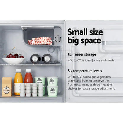 Small refrigerator interior with organized drinks, food containers, and labeled freezer section.