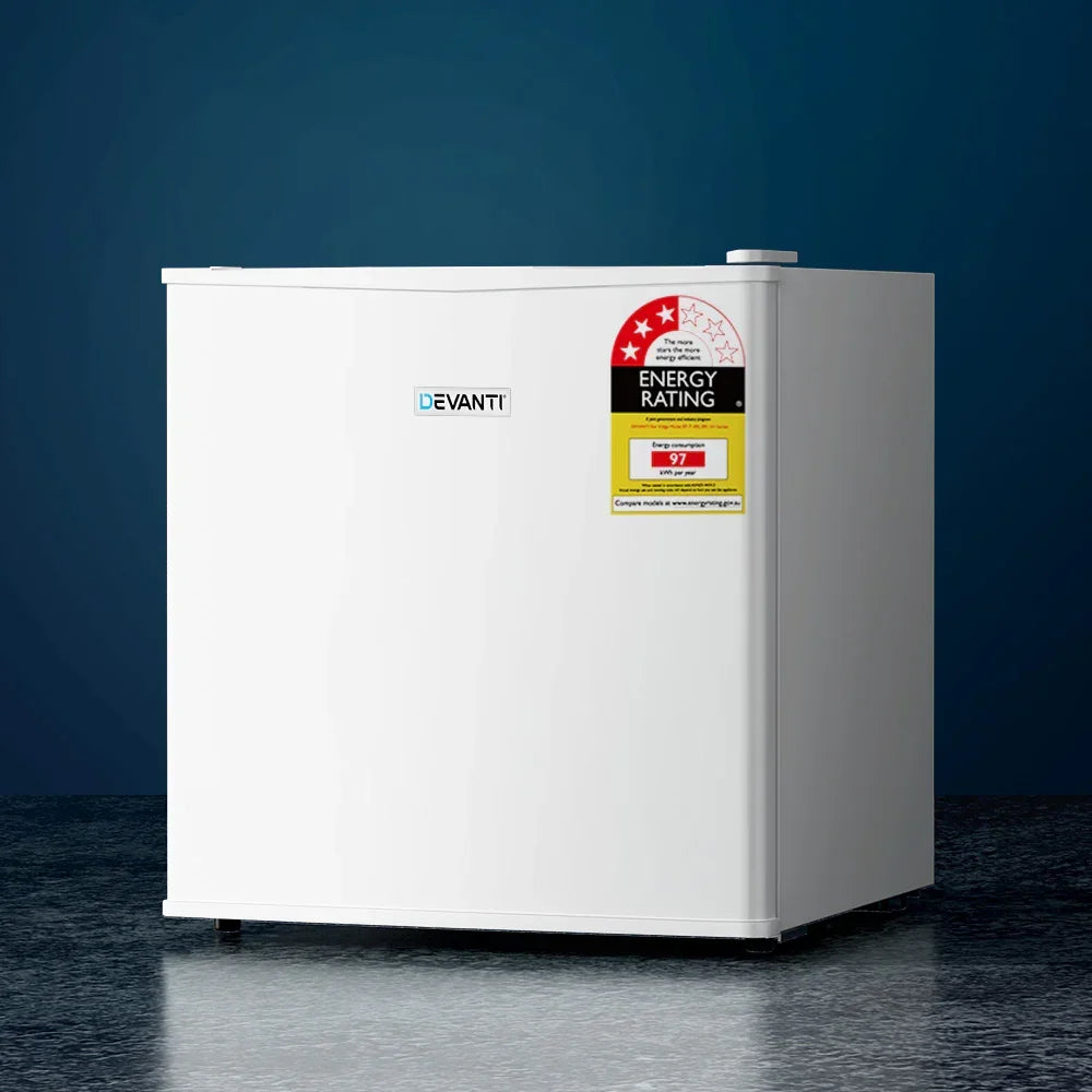 White compact bar fridge with energy rating label, set against a blue background