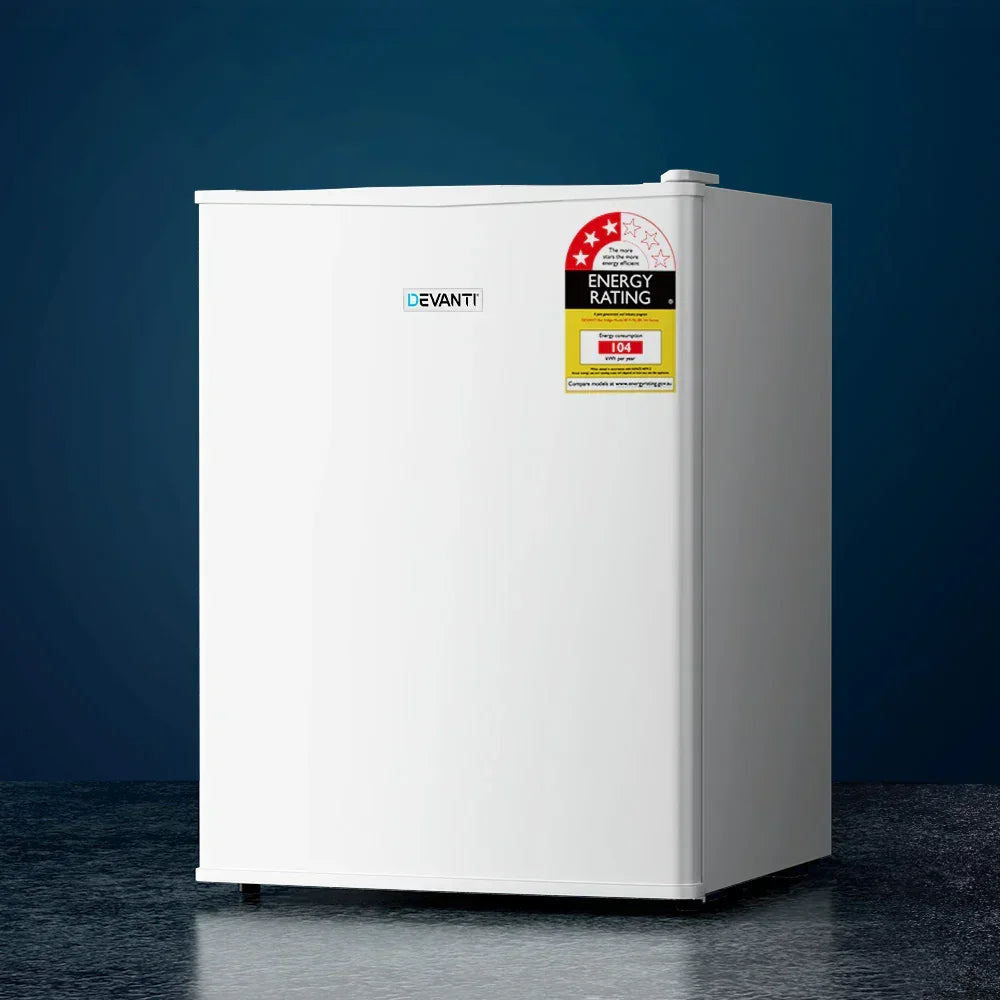 Compact white bar fridge with energy rating sticker, minimalist design, on dark background