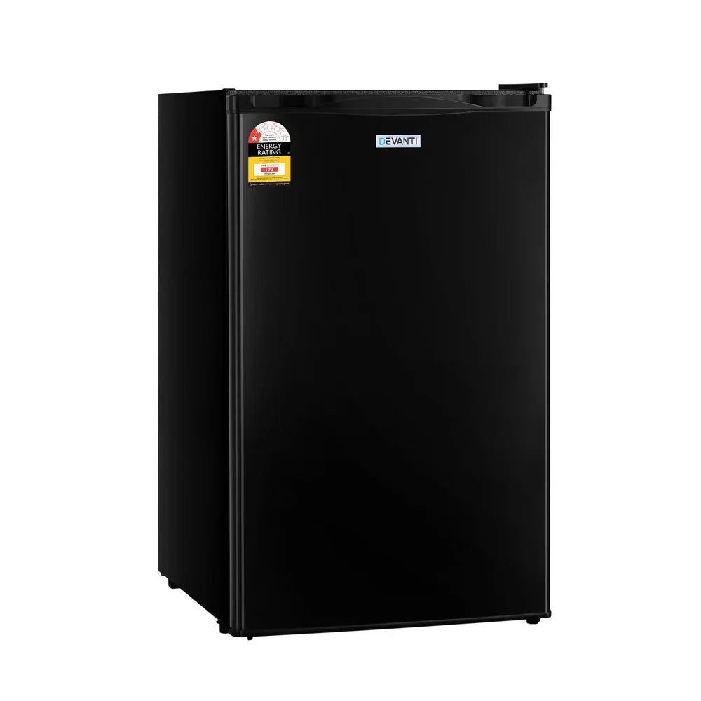 Black compact bar fridge with energy rating sticker, modern single-door design