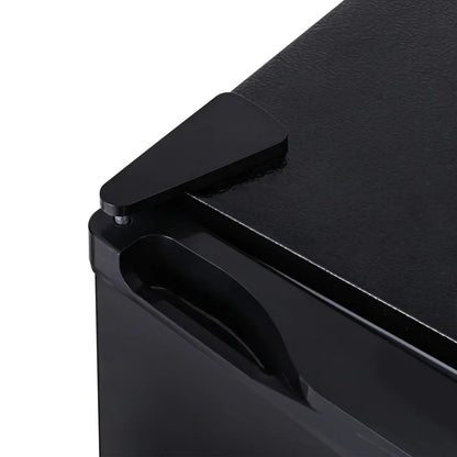 Close-up of a black metal cabinet corner with a triangular corner protector and side handle