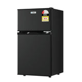 Black double door compact fridge freezer with energy rating sticker, isolated on white