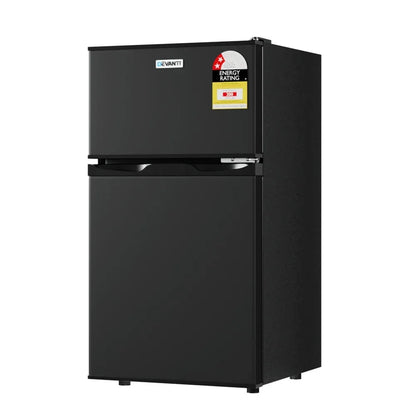 Black double door compact fridge freezer with energy rating sticker, isolated on white