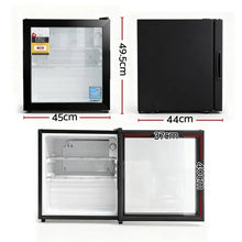 Black mini fridge with glass door, compact dimensions labeled, interior shelves visible