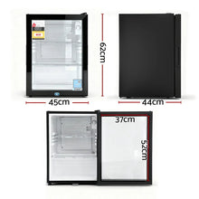 Black mini fridge with glass door, internal shelves, and dimensions shown in centimeters