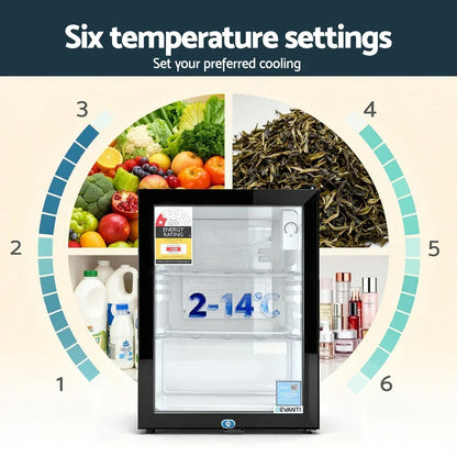 Mini fridge with glass door, digital temperature range 2-14°C, six cooling settings, and compartments for drinks, fruits, skincare and tea.