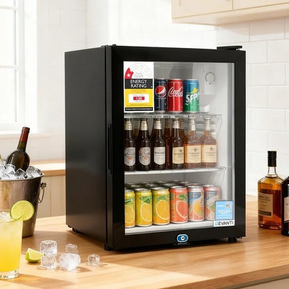 Black glass door bar fridge stocked with drinks on a kitchen bench, energy rating label visible