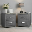 Pair of modern grey fabric bedside tables with drawers, flowers, lamp, books, and clock