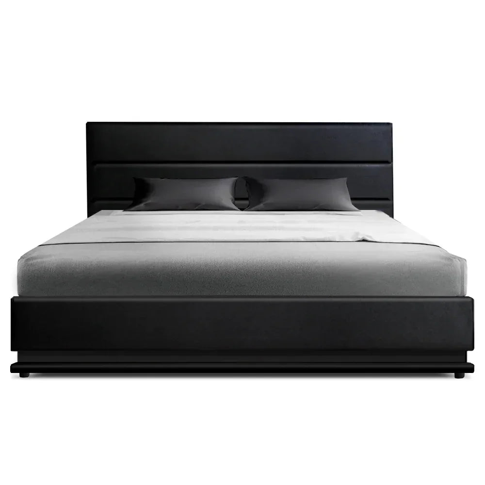 Modern black upholstered bed frame with gray mattress and matching pillows
