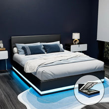 Modern black platform bed with LED lights and under-bed storage in a stylish bedroom