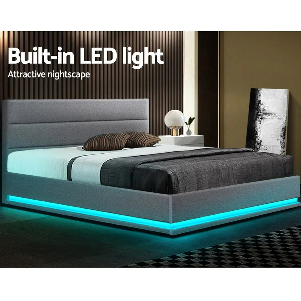Modern grey bed frame with built-in blue LED lighting in a stylish bedroom setting