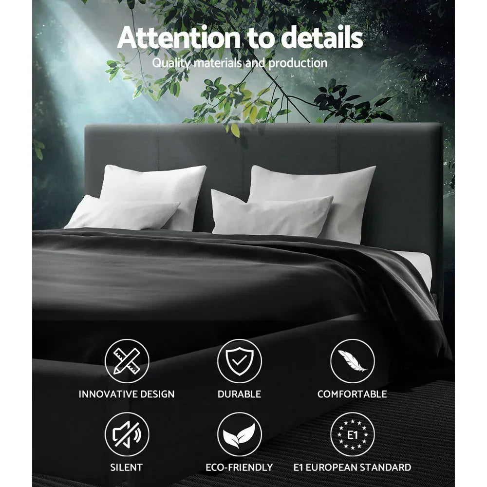 Modern dark upholstered bed with white pillows and blanket, quality icons and forest backdrop