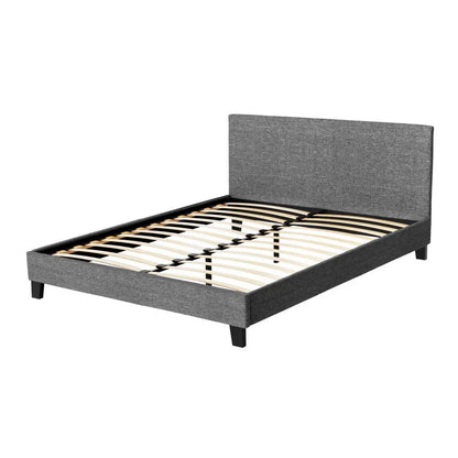 Modern grey upholstered bed frame with headboard and wooden slats on white background