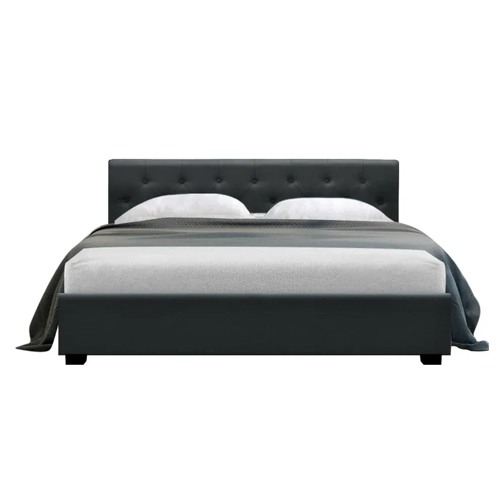 Modern charcoal upholstered bed frame with tufted headboard and bedding on white background