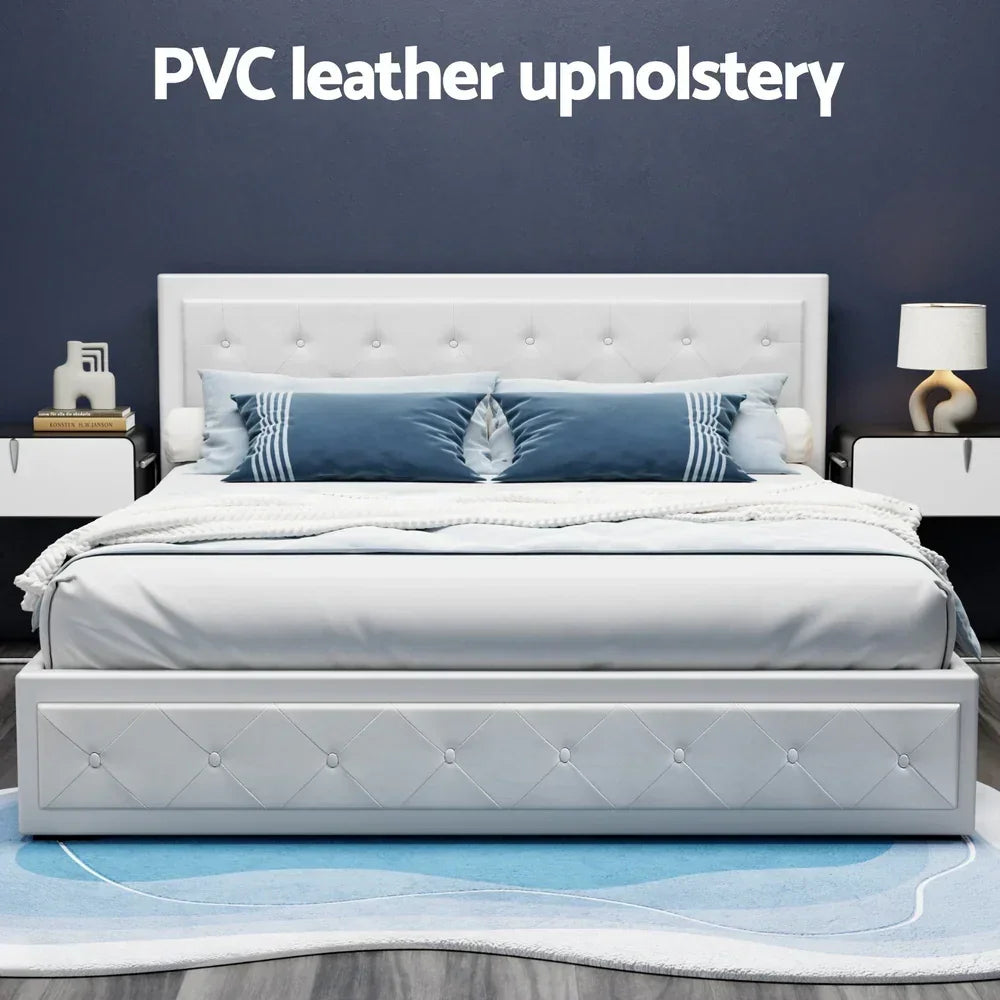 White PVC leather upholstered bed with blue accent pillow, modern nightstands and lamp