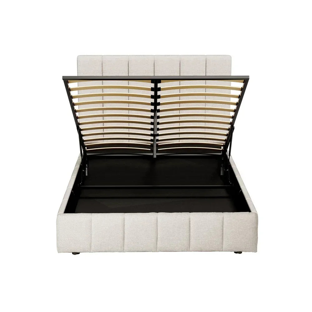 Beige upholstered storage bed frame with open gas lift slatted base, white background