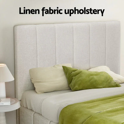 Modern linen fabric upholstered bed with vertical panel headboard, green and cream bedding.