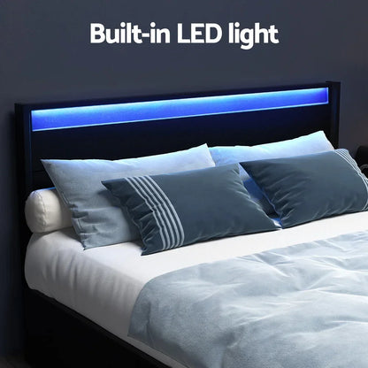 Modern bed frame with built-in blue LED headboard light and plush blue bedding