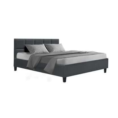 Modern grey upholstered bed frame with headboard, bedding, and pillows on white background