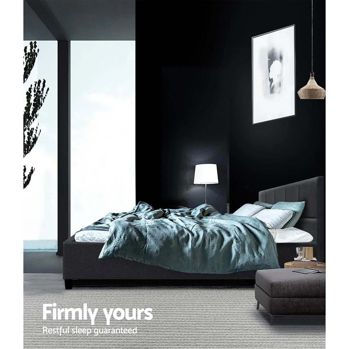Modern bedroom with upholstered bed, blue quilt, pillows, nightstand, and ambient lighting