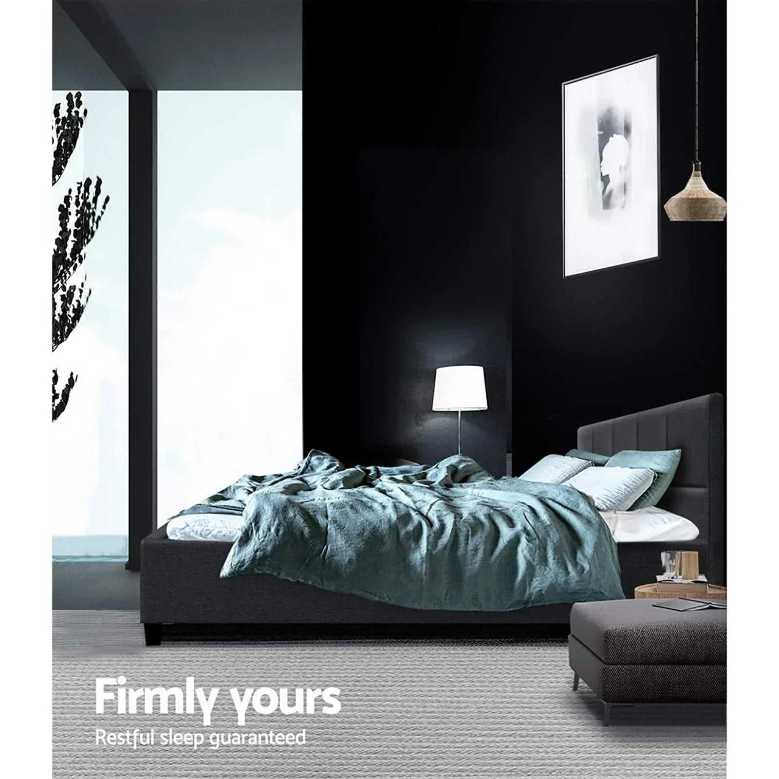 Modern bedroom with upholstered bed, blue quilt, pillows, nightstand, and ambient lighting