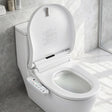 Smart bidet toilet with control panel, modern bathroom setup, heated seat, and bidet functions
