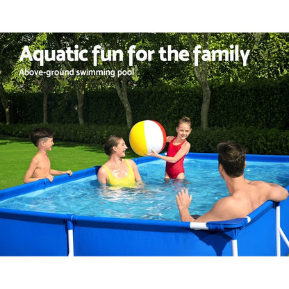 Family playing with beach ball in an above-ground backyard swimming pool