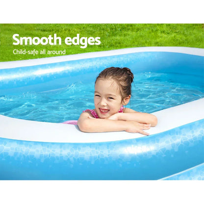 Smiling child in a blue inflatable pool with smooth, child-safe edges outdoors