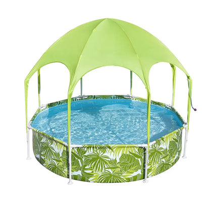 Round outdoor swimming pool with tropical leaf print and green canopy shade cover