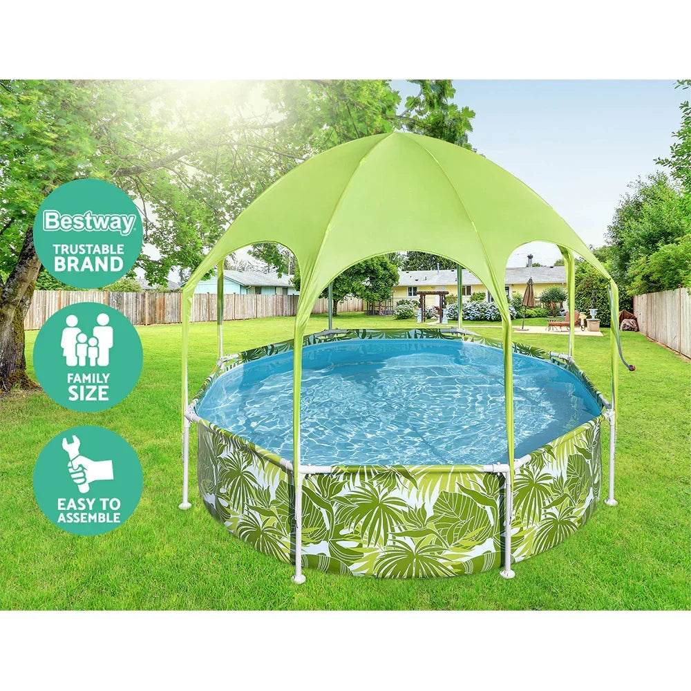 Family size outdoor above ground pool with leaf print and green canopy in backyard