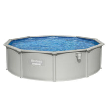 Round above ground outdoor swimming pool with metal frame and clear blue water
