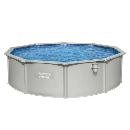 Round above ground outdoor swimming pool with metal frame and clear blue water