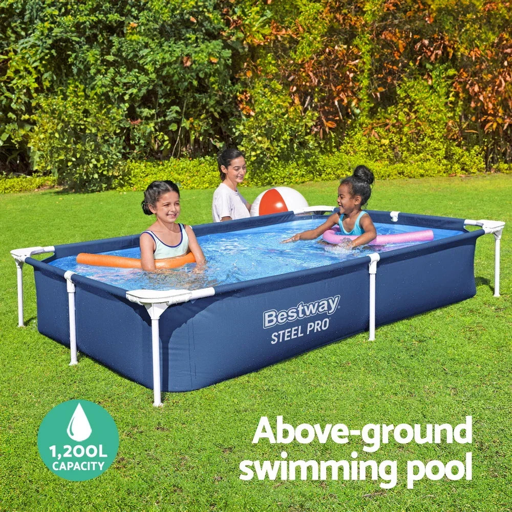Rectangular above-ground swimming pool with kids playing on a grassy backyard.