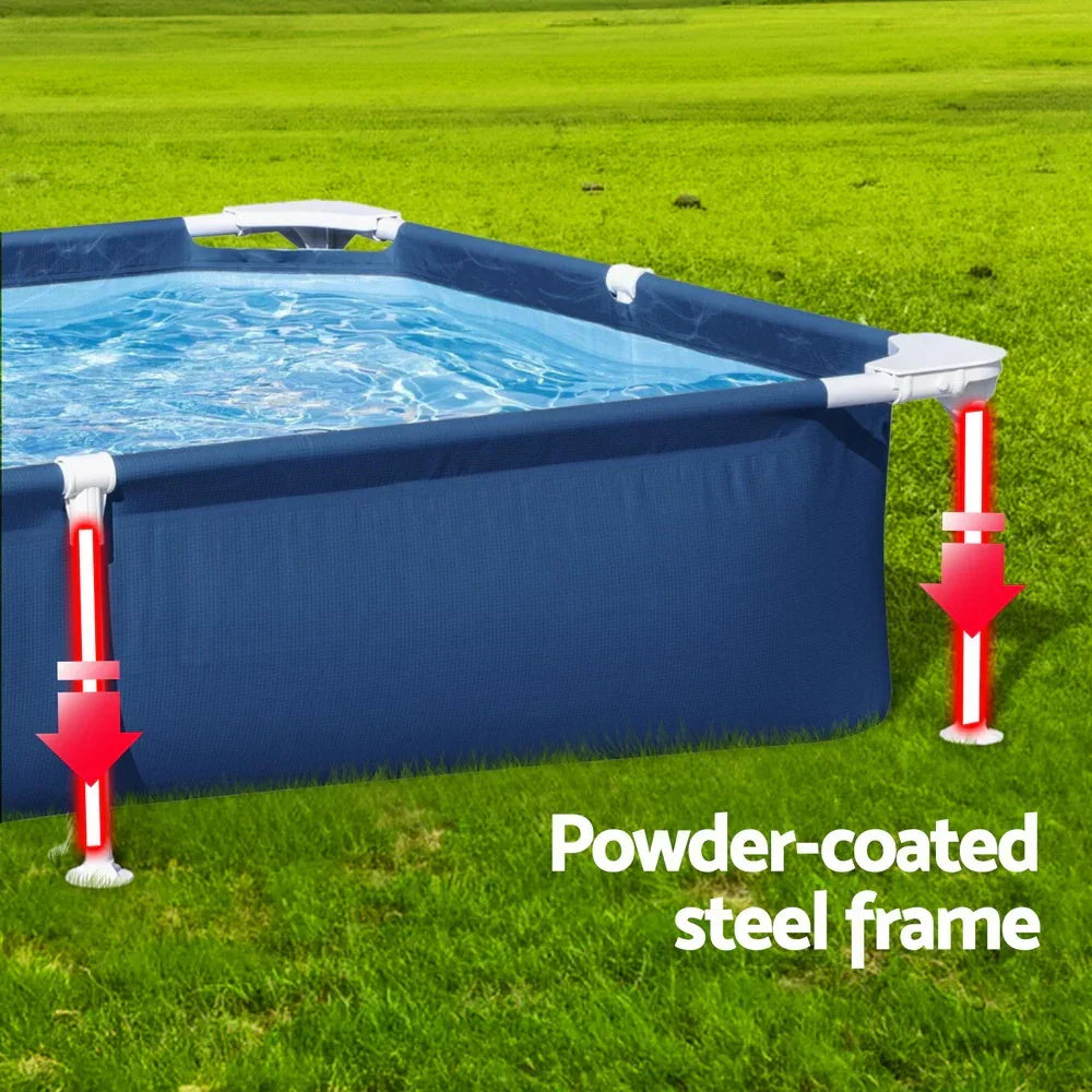 Rectangular above-ground pool with blue cover and powder-coated steel frame on grass.