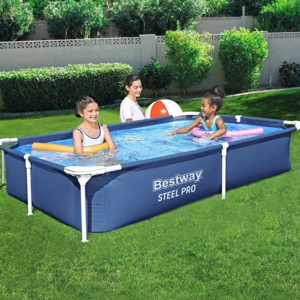Children playing in a rectangular Bestway Steel Pro above ground pool in a backyard.