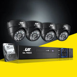 Four black UL-Tech dome security cameras with DVR system and hard drive on a yellow background.