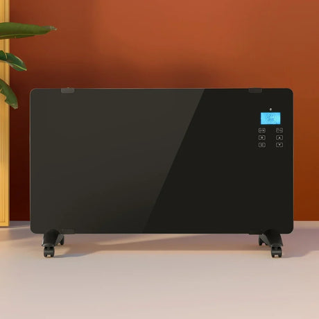 Black glass panel heater with digital control display on caster wheels in a modern room