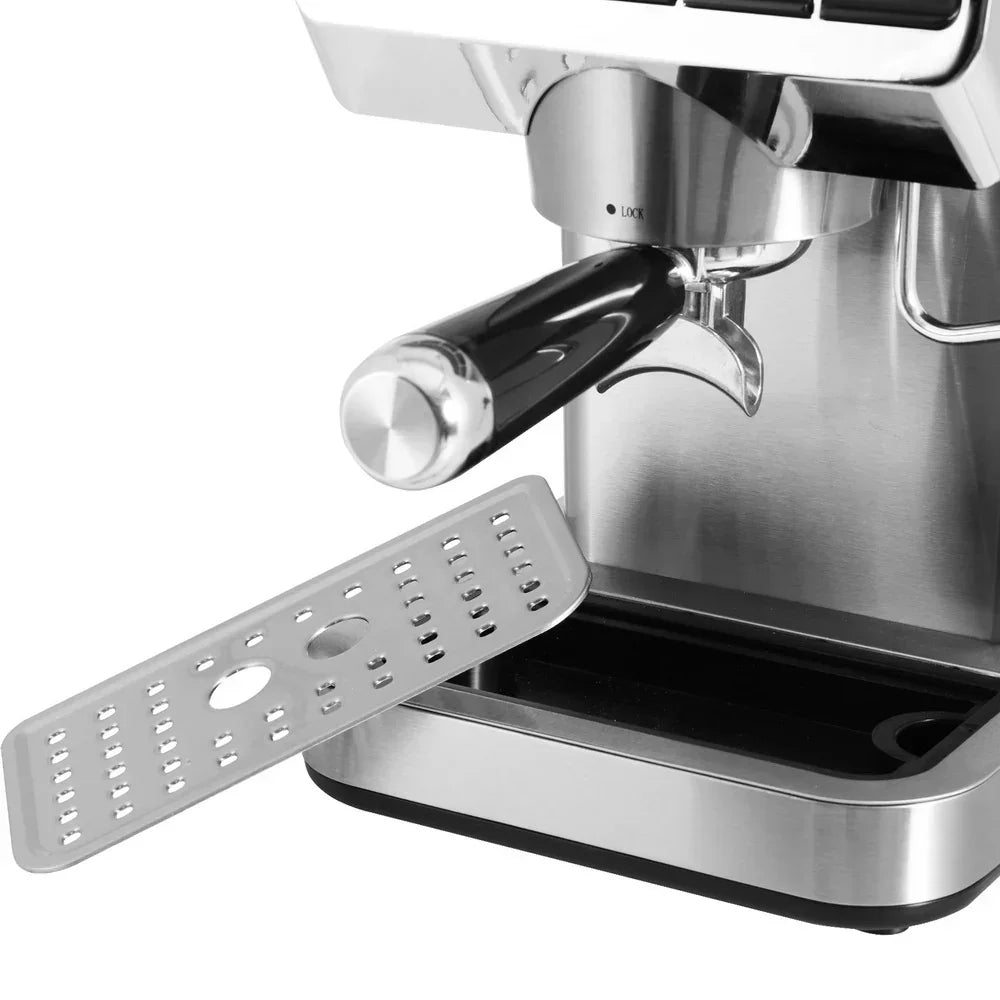 Close-up of stainless steel espresso coffee machine with removable drip tray.