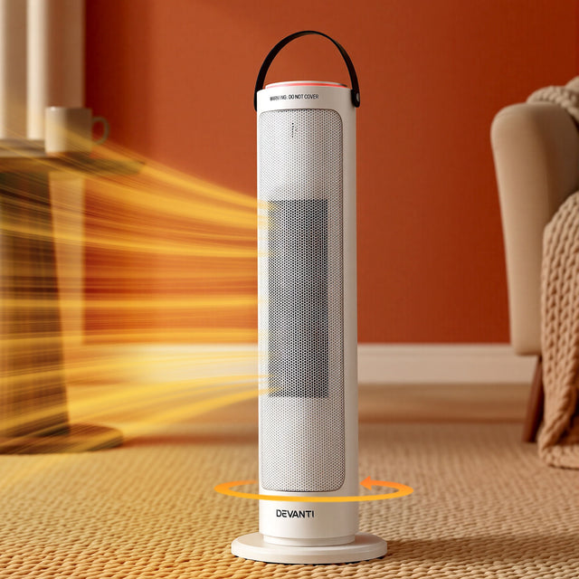 White tower heater with oscillation feature shown in a cozy living room setting, blowing warm air