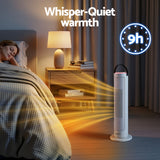 Tower heater providing quiet warmth in bedroom beside sleeping person and nightstand.