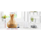 Wood grain essential oil diffuser with remote, power cord, water cup, and measurements in cm