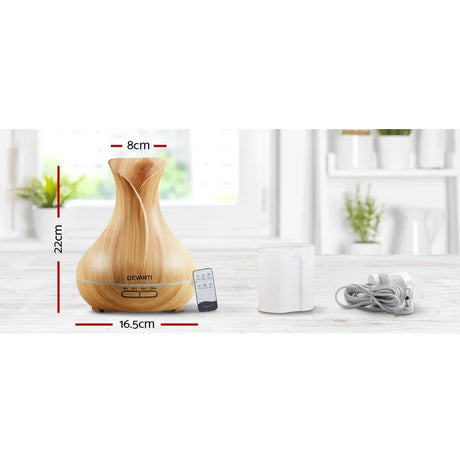 Wood grain essential oil diffuser with remote, power cord, water cup, and measurements in cm