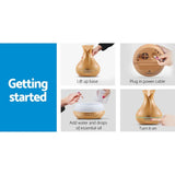 Step-by-step guide for using a wood grain essential oil diffuser, filling and powering on device.
