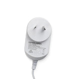 White Australian plug AC DC power adapter with cable and clear label on a white background