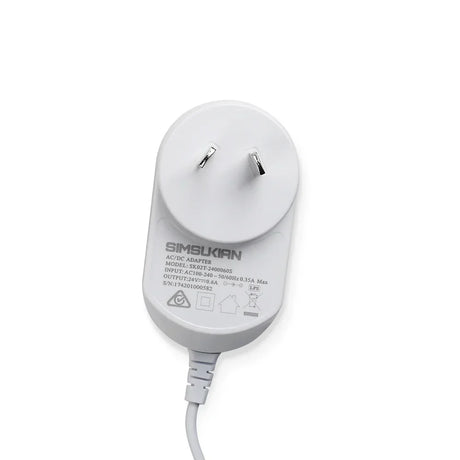 White Australian plug AC DC power adapter with cable and clear label on a white background